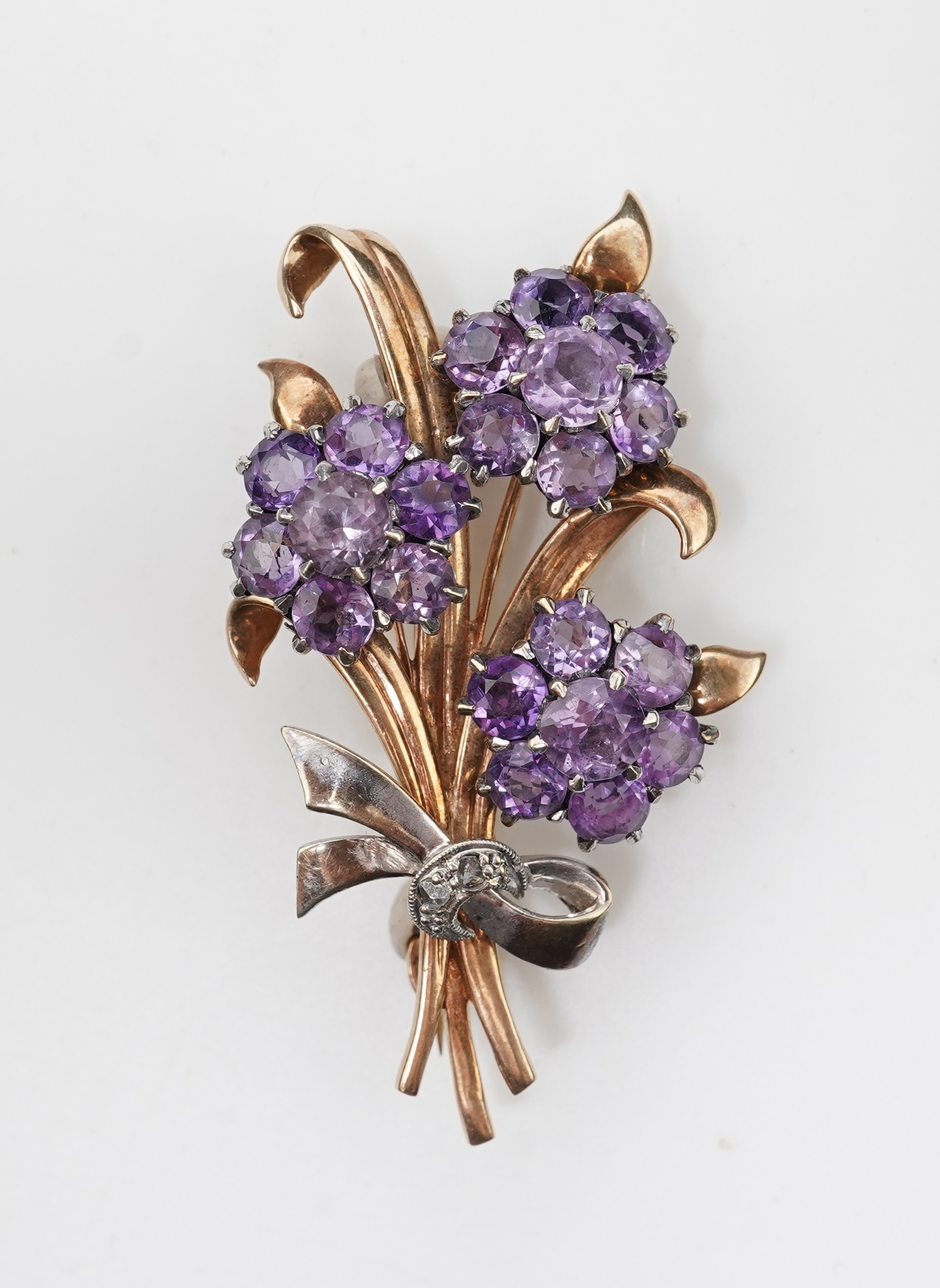 A Retro amethyst and diamond brooch, circa 1956